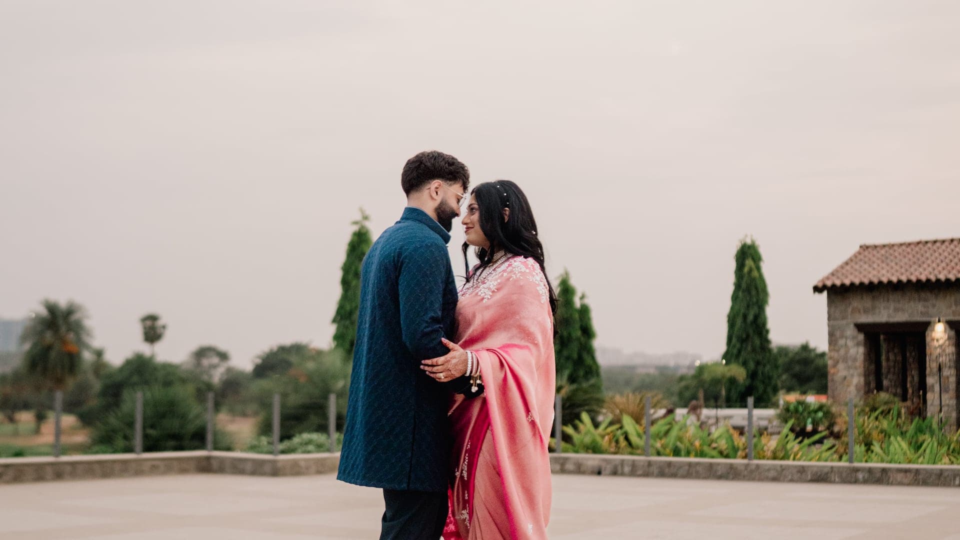 Sneha and Sudarshan sharing a quiet moment outdoors