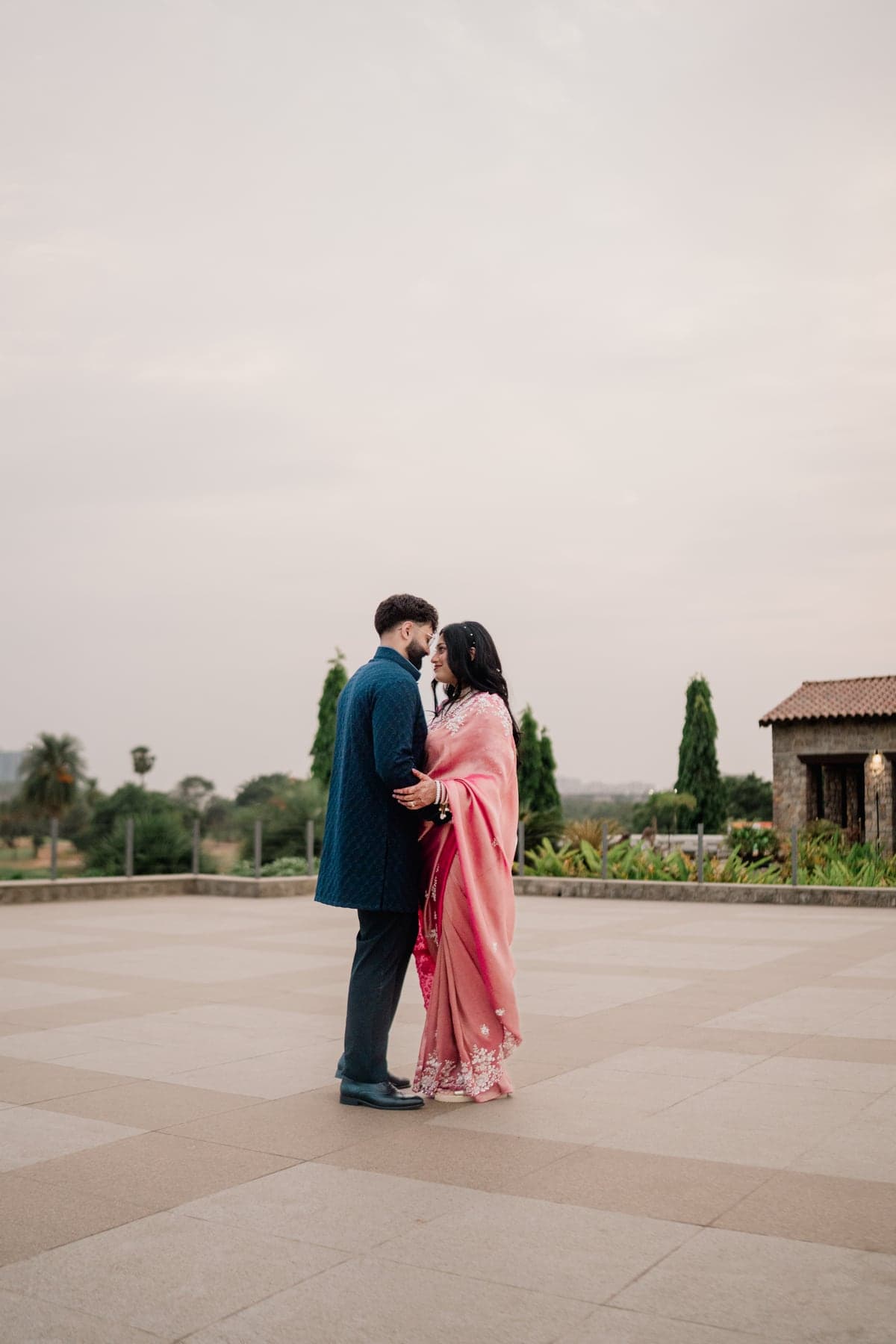 Sneha and Sudarshan sharing a quiet moment outdoors